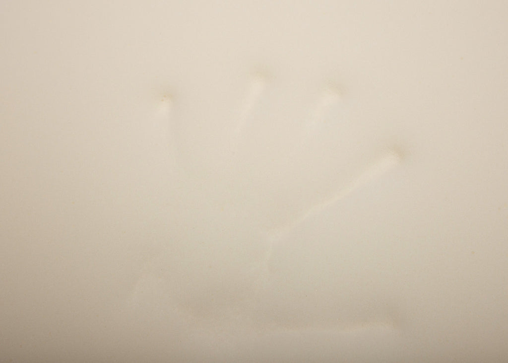 orthopädische Matte für Wau-Snuggle Nahaufnahme der Matte mit Handabdruck zur Darstellung