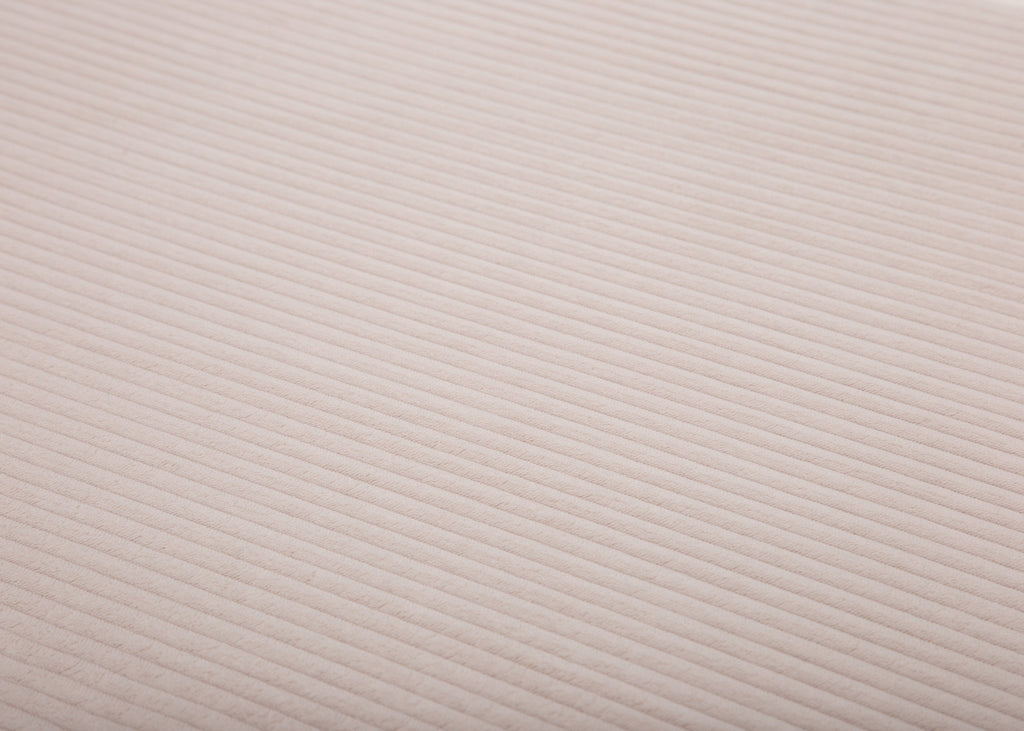 Stoffnahaufname vom Cord in Creme